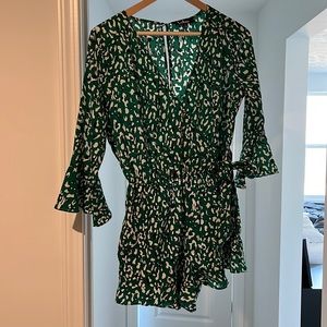 Lulu’s Make Moves Green and Black Print Flounce Sleeve Romper
